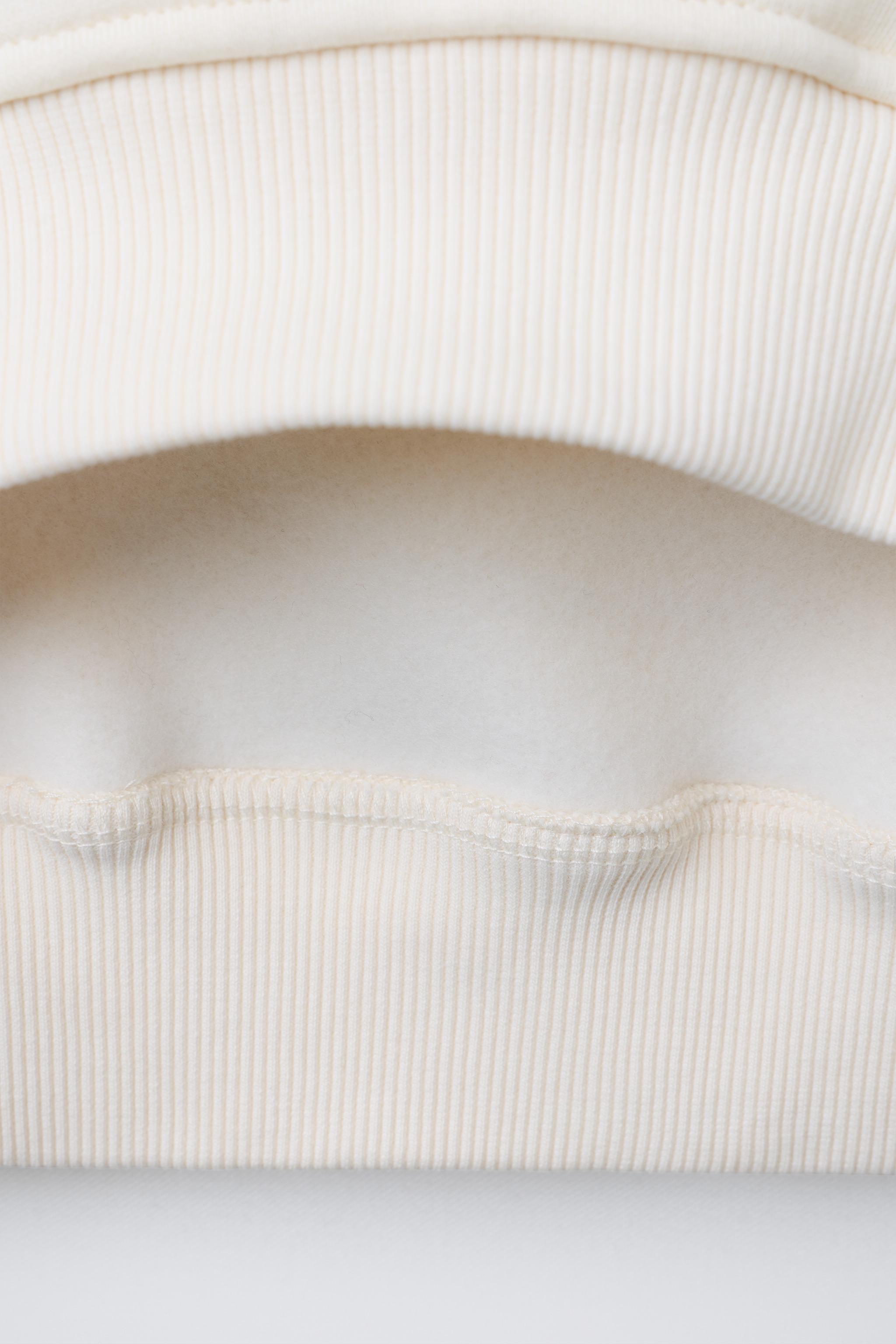 BEADED FLOWER SWEATSHIRT